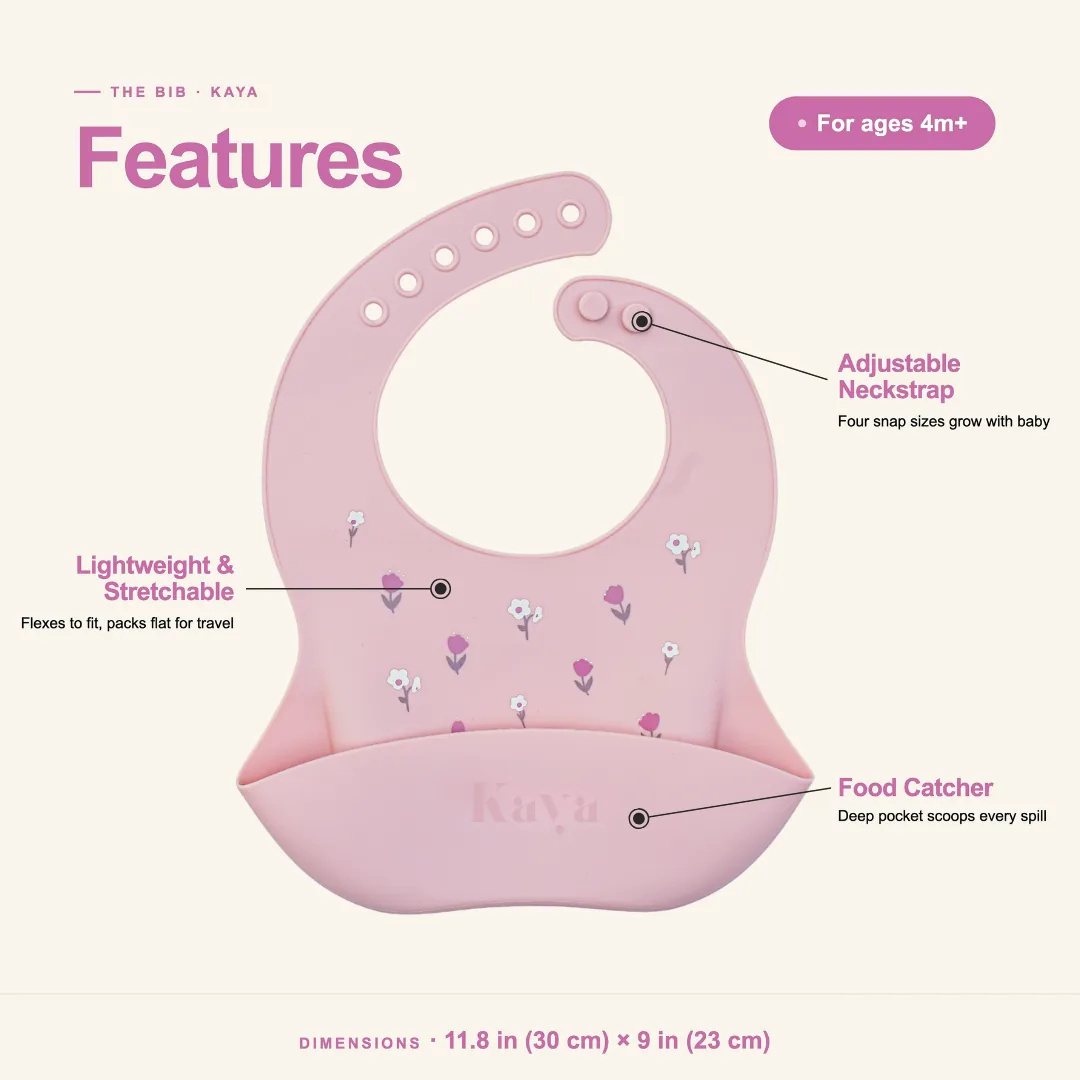 Pink & White Floral KAYA bib features: adjustable neckstrap, lightweight stretchable silicone and a food-catcher pocket; about 11.8 by 9 inches